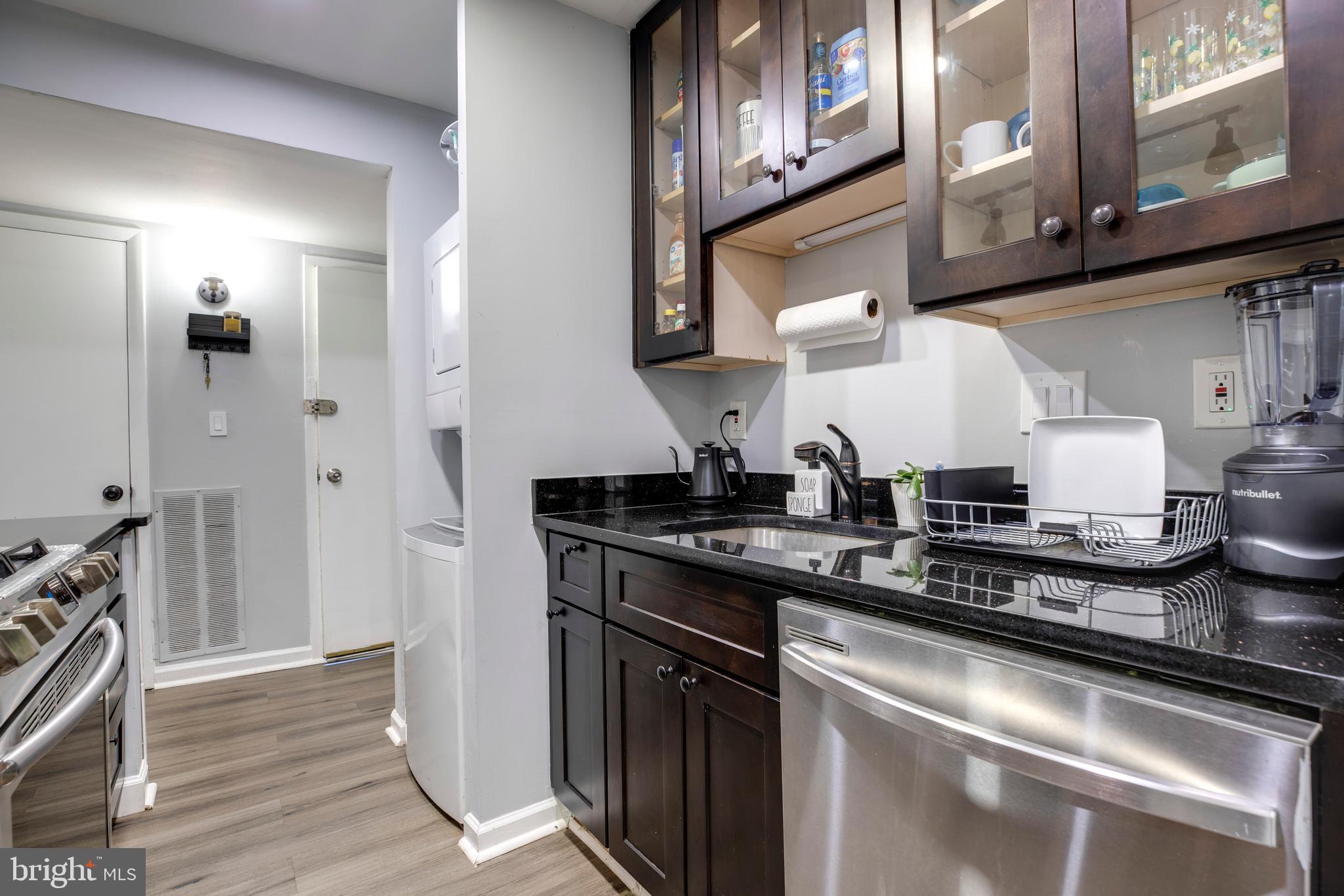 3382 Hewitt Avenue, Unit 102 Silver Spring, MD 20906 - Photo 7 of 22 a kitchen with stainless steel appliances granite countertop a sink and a stove