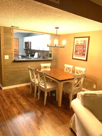 a view of a swimming pool and lounge chair