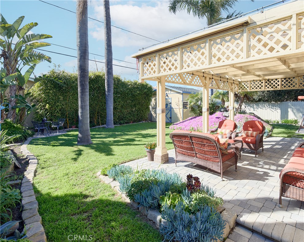 615 Bungalow Drive El Segundo, CA 90245 - Photo 12 of 28 a view of a patio with a table and chairs