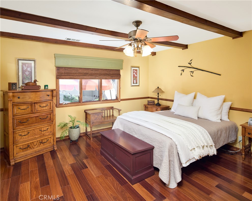615 Bungalow Drive El Segundo, CA 90245 - Photo 15 of 28 a bedroom with a bed and wooden floor