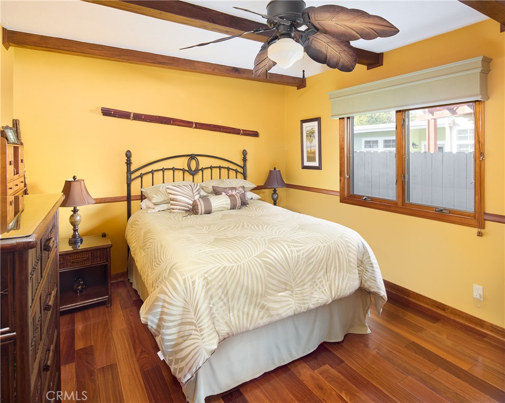 615 Bungalow Drive El Segundo, CA 90245 - Photo 18 of 28 a bedroom with a bed and wooden floor