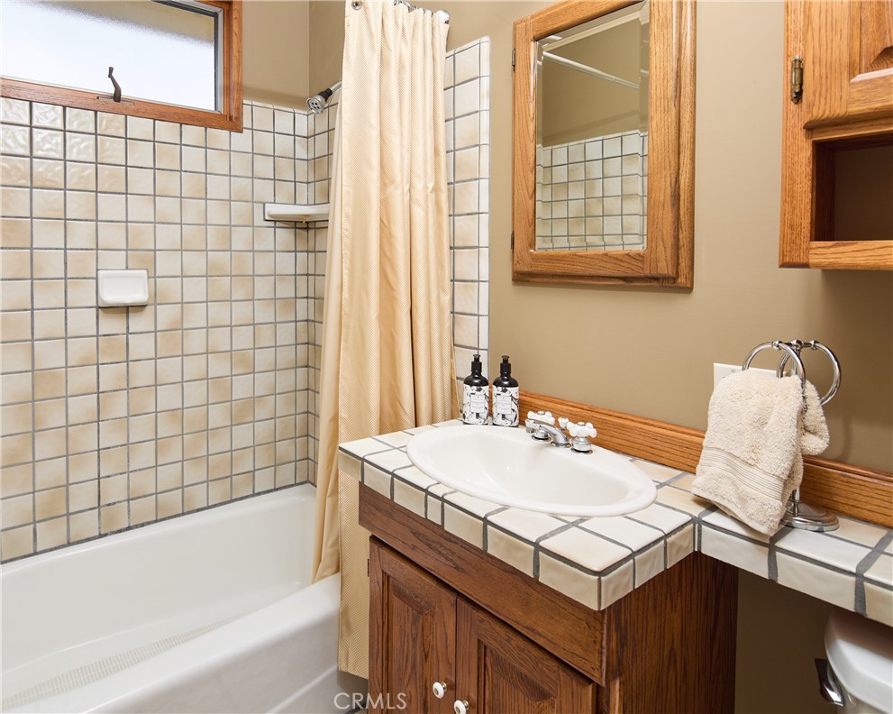 615 Bungalow Drive El Segundo, CA 90245 - Photo 19 of 28 a bathroom with a sink vanity tub and a shower