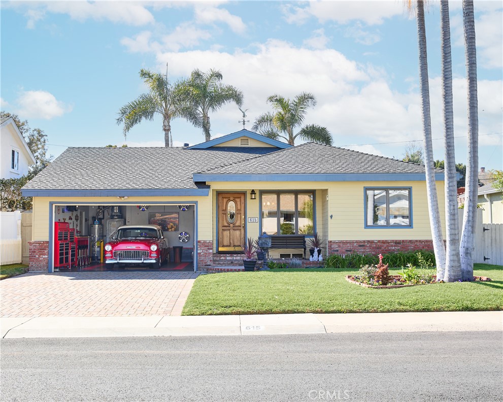 615 Bungalow Drive El Segundo, CA 90245 - Photo 26 of 28 a front view of a house with a garden and parking