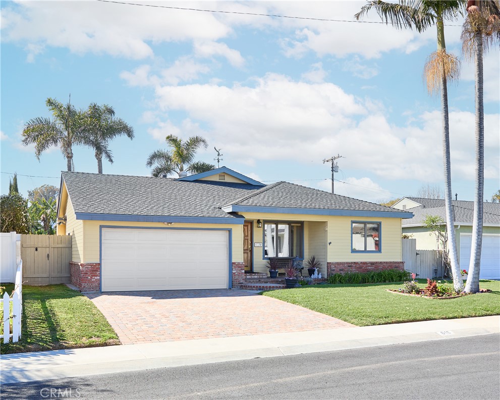 615 Bungalow Drive El Segundo, CA 90245 - Photo 27 of 28 a front view of a house with a yard and garage