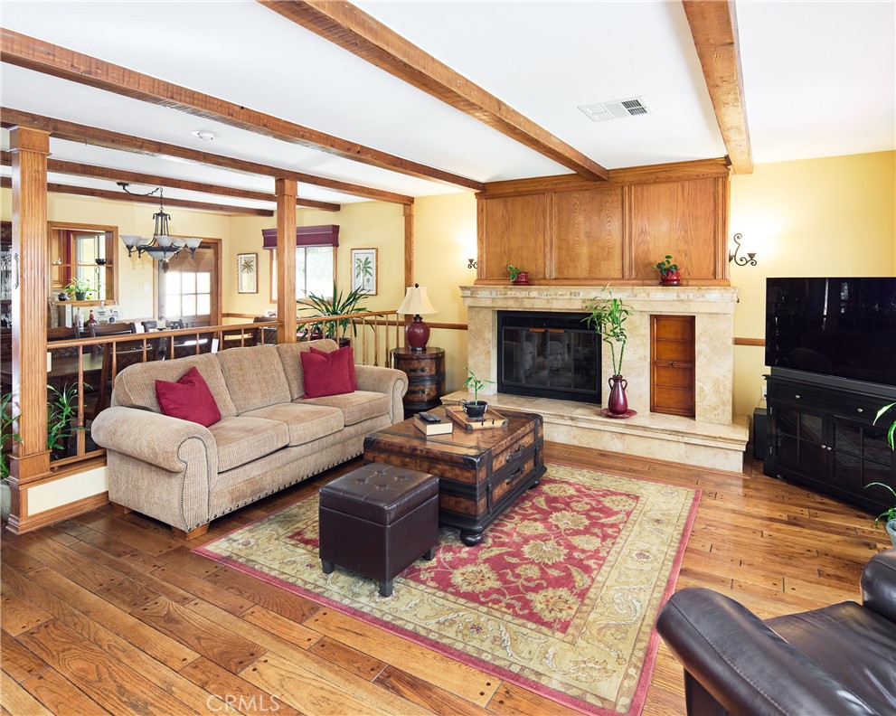 615 Bungalow Drive El Segundo, CA 90245 - Photo 8 of 28 a living room with furniture large window and a fireplace