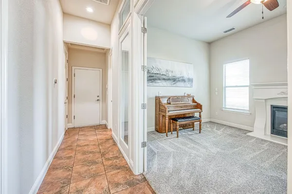 a bedroom with a bed couch and window