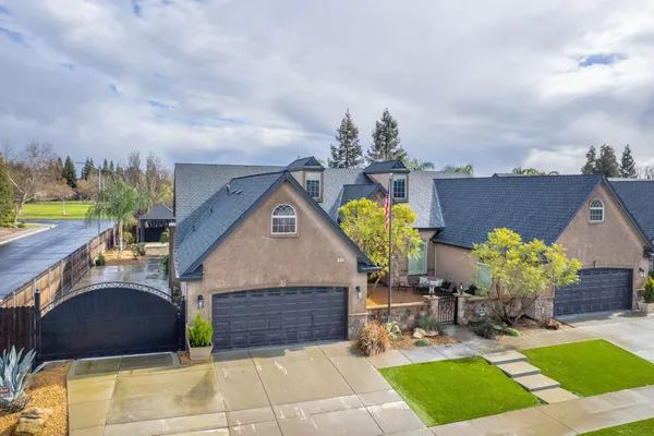 a living room with fireplace furniture and a large window