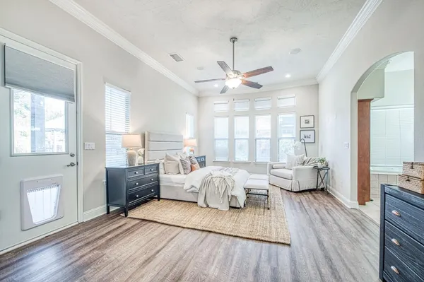 a house view with swimming pool in front of it