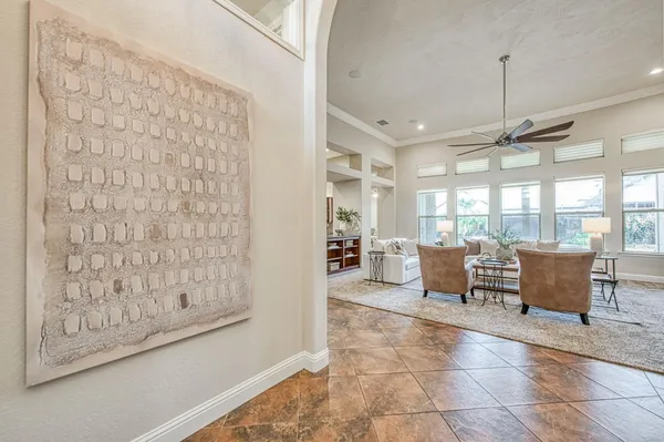 a living room with furniture and a glass door