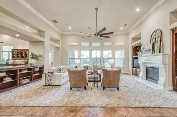 a living room with furniture and a fireplace
