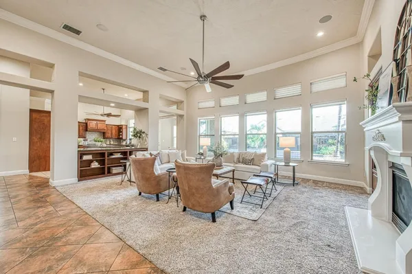 a large kitchen with a table and chairs