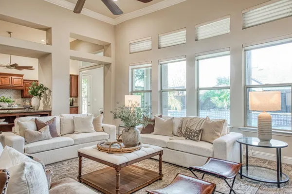 a room with stainless steel appliances kitchen island granite countertop a sink and cabinets