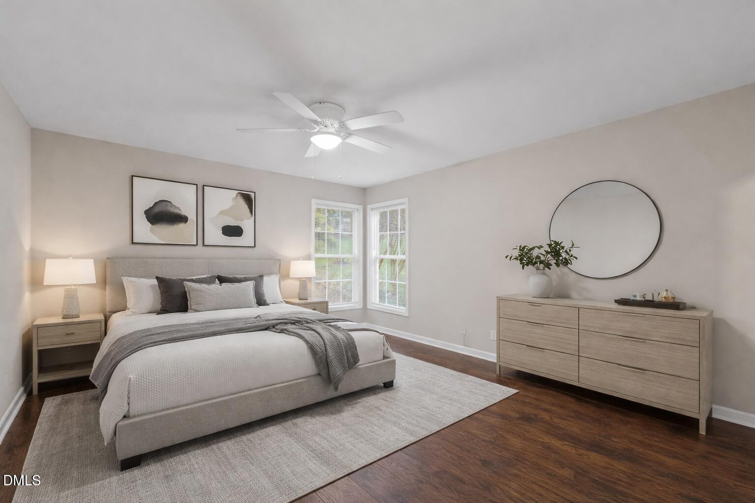 140 Melksham Road Wake Forest, NC 27587 - Photo 28 of 34 a bedroom with a large bed and a chandelier