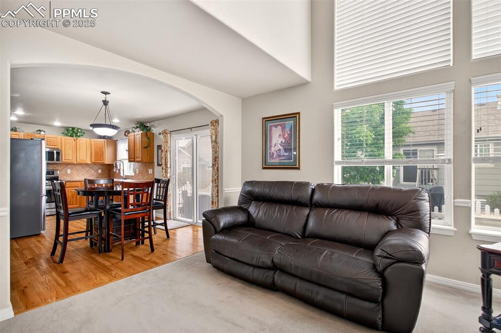 7374 Maybeck View Peyton, CO 80831 - Photo 13 of 38 a living room with furniture and wooden floor