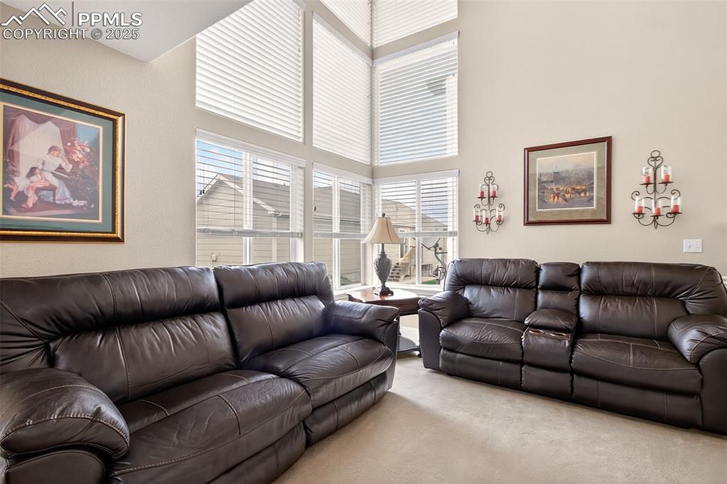 7374 Maybeck View Peyton, CO 80831 - Photo 14 of 38 a living room with furniture and a large window