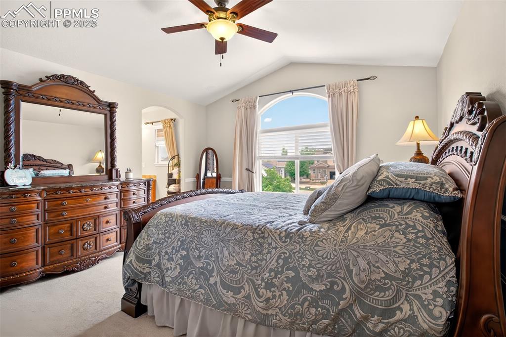 7374 Maybeck View Peyton, CO 80831 - Photo 16 of 38 a bedroom with a bed and wooden floor