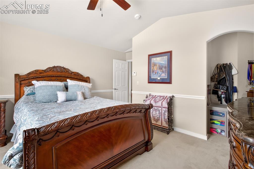 7374 Maybeck View Peyton, CO 80831 - Photo 17 of 38 a bedroom with a bed and a dresser