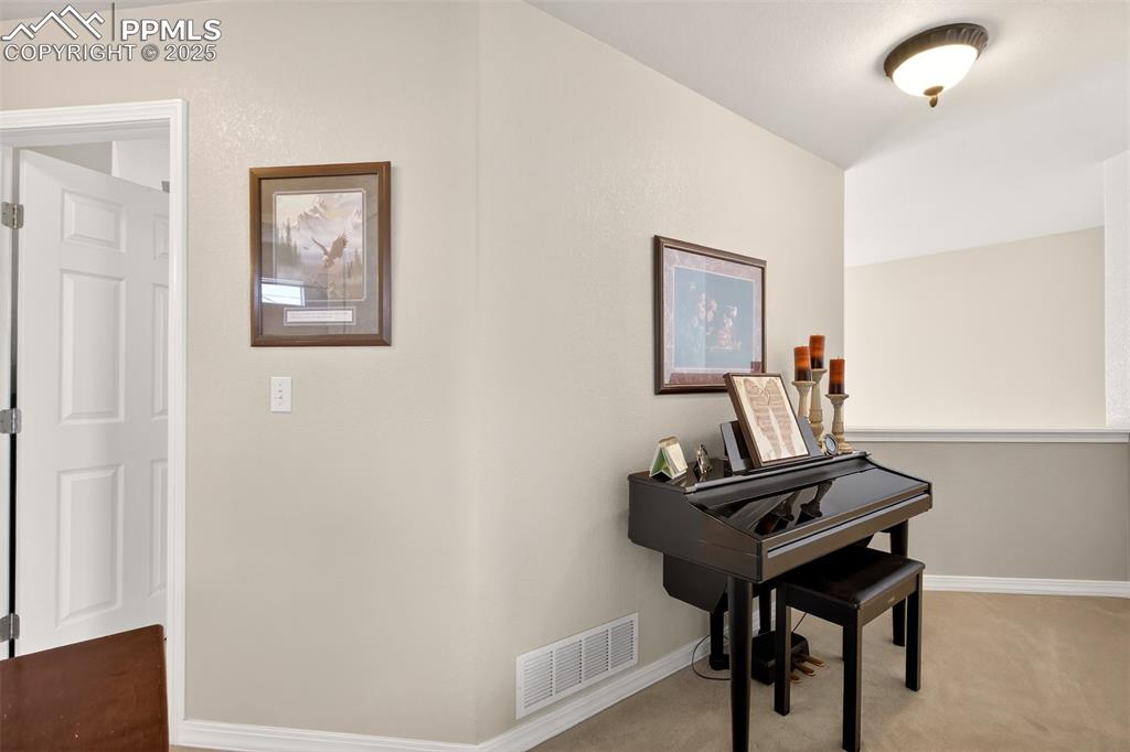 7374 Maybeck View Peyton, CO 80831 - Photo 22 of 38 a view of a workspace with furniture