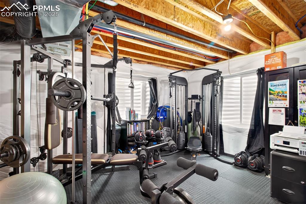 7374 Maybeck View Peyton, CO 80831 - Photo 29 of 38 a view of a room with gym equipment