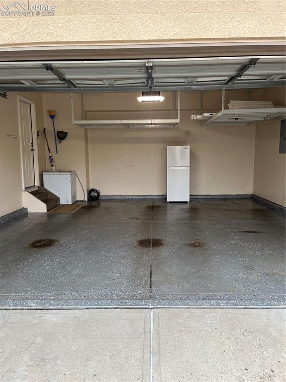 7374 Maybeck View Peyton, CO 80831 - Photo 32 of 38 a view of a garage