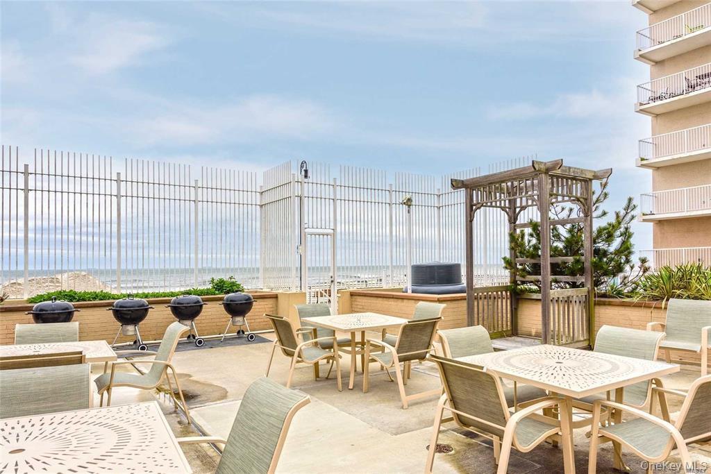 25 Neptune Boulevard, Unit 9S Long Beach, NY 11561 - Photo 19 of 21 a view of a patio with swimming pool