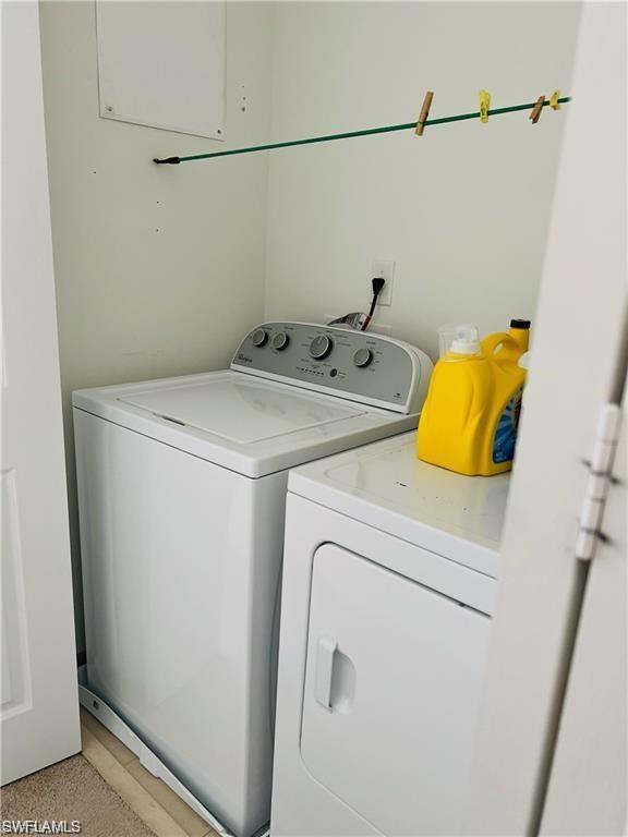 5293 Beckton Road Ave Maria, FL 34142 - Photo 17 of 17 a utility room with dryer and washer