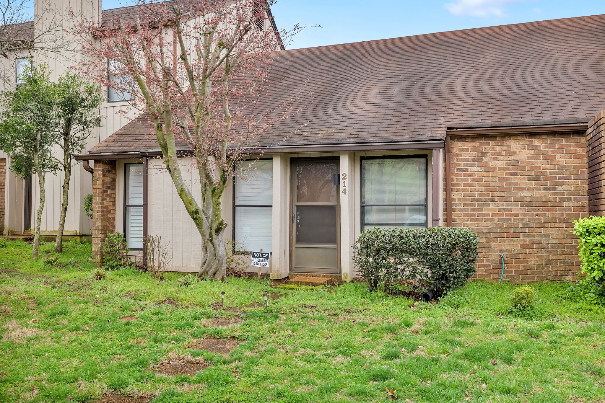 a front view of a house with garden