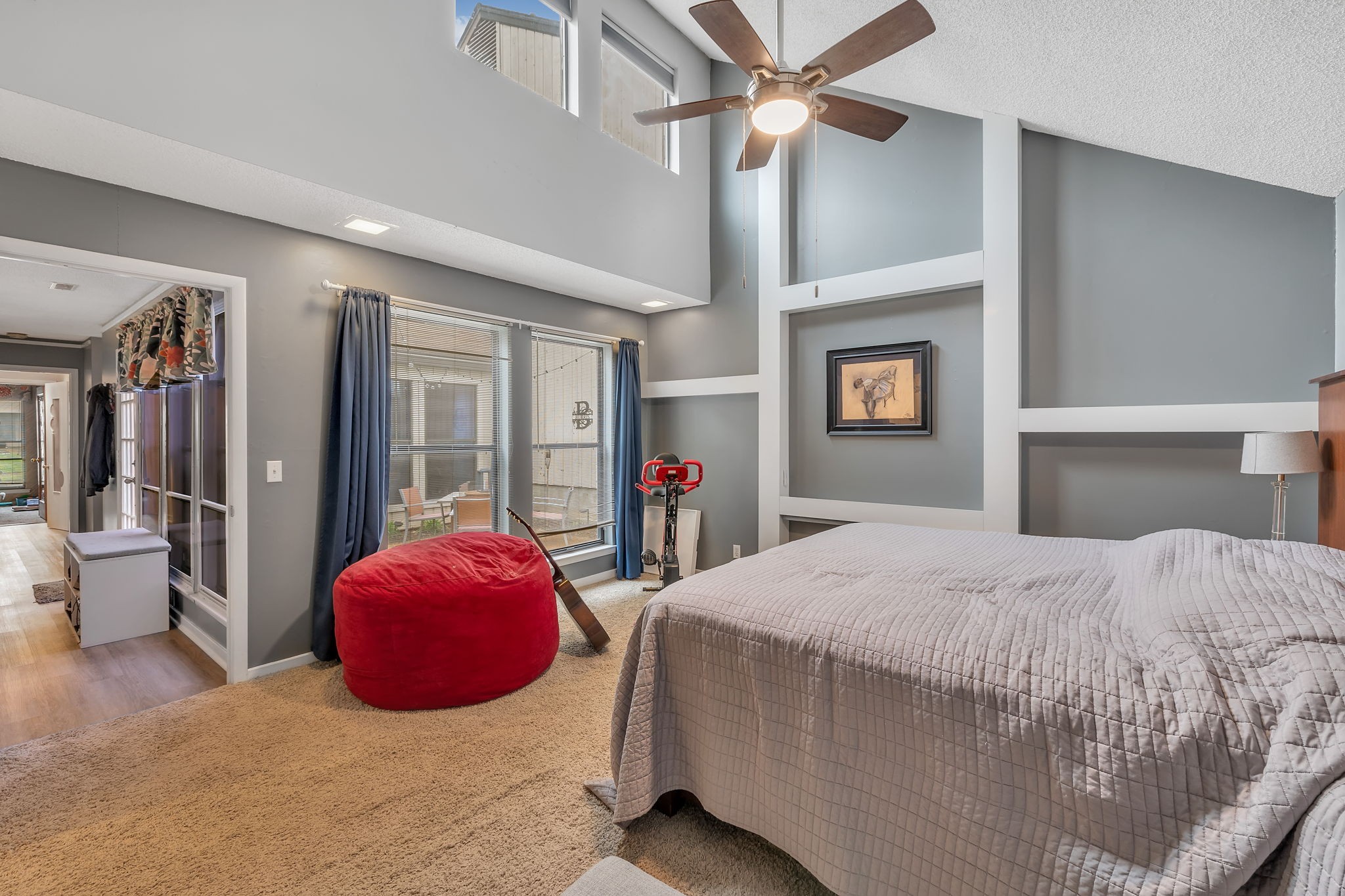 214 Harpers Mill Road Hermitage, TN 37076 - Photo 30 of 42 a spacious bedroom with a bed and a chandelier