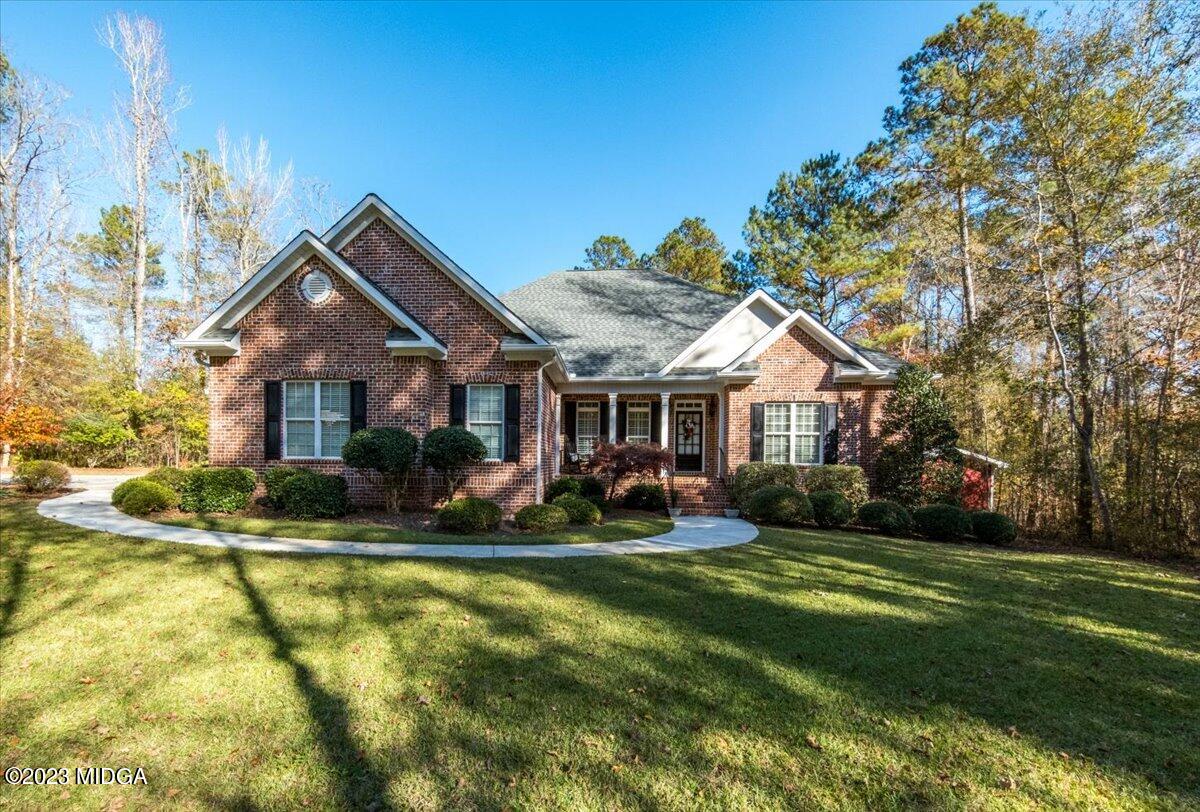60 Walden Road Forsyth, GA 31029 - Photo 1 of 31 a front view of house with yard and green space
