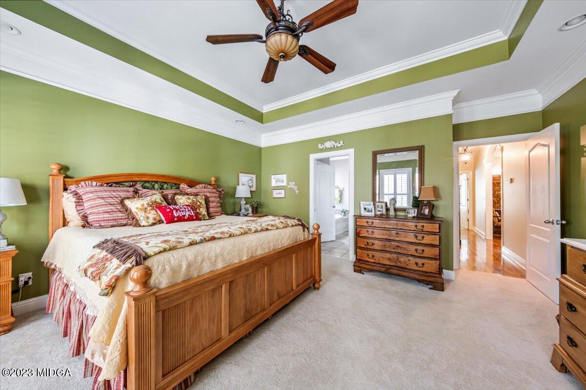 60 Walden Road Forsyth, GA 31029 - Photo 14 of 31 a bedroom with a bed and a chandelier