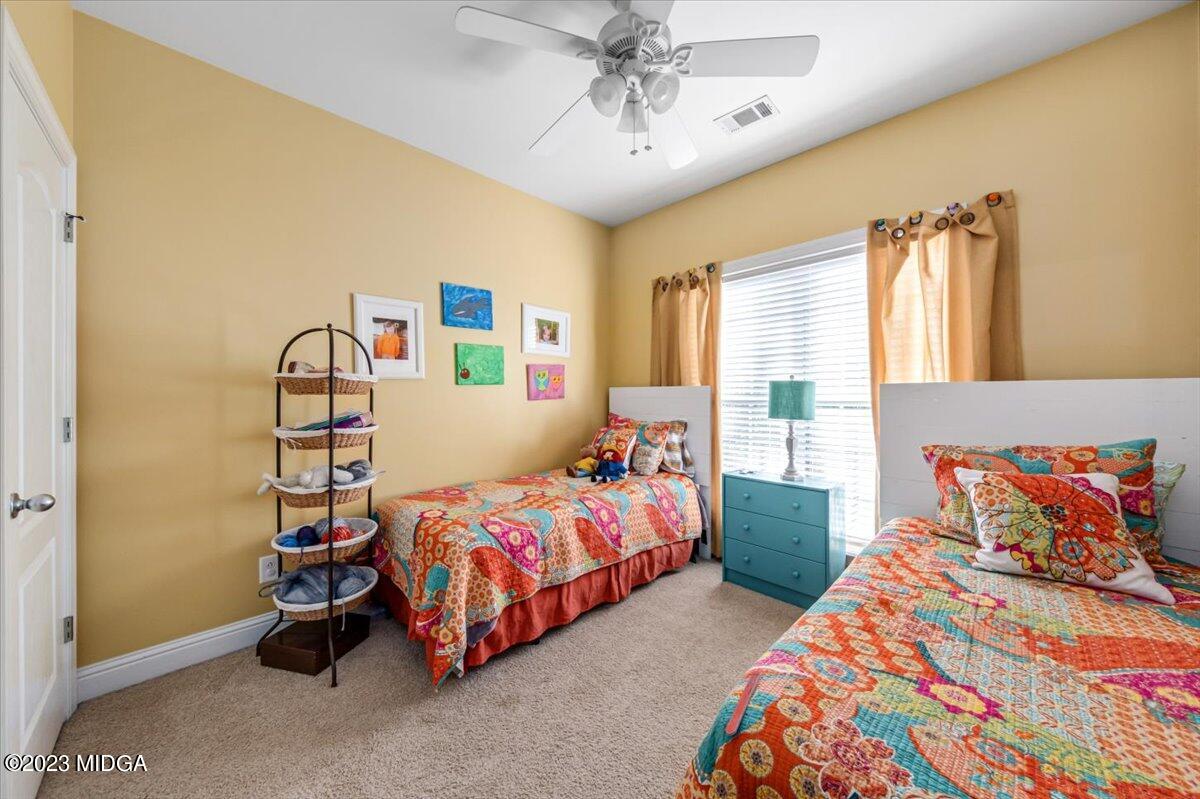 60 Walden Road Forsyth, GA 31029 - Photo 19 of 31 a bedroom with two beds and a window