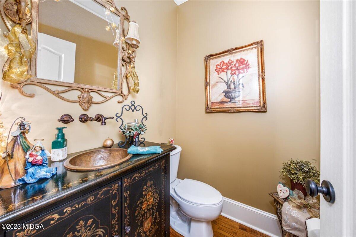 60 Walden Road Forsyth, GA 31029 - Photo 22 of 31 a bathroom with a sink mirror vanity and toilet