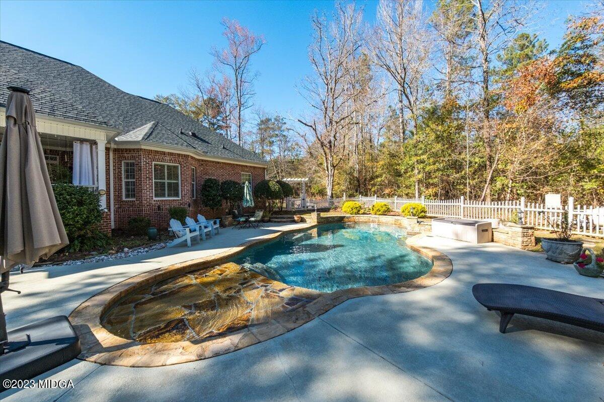 60 Walden Road Forsyth, GA 31029 - Photo 28 of 31 a view of a house with backyard and sitting area