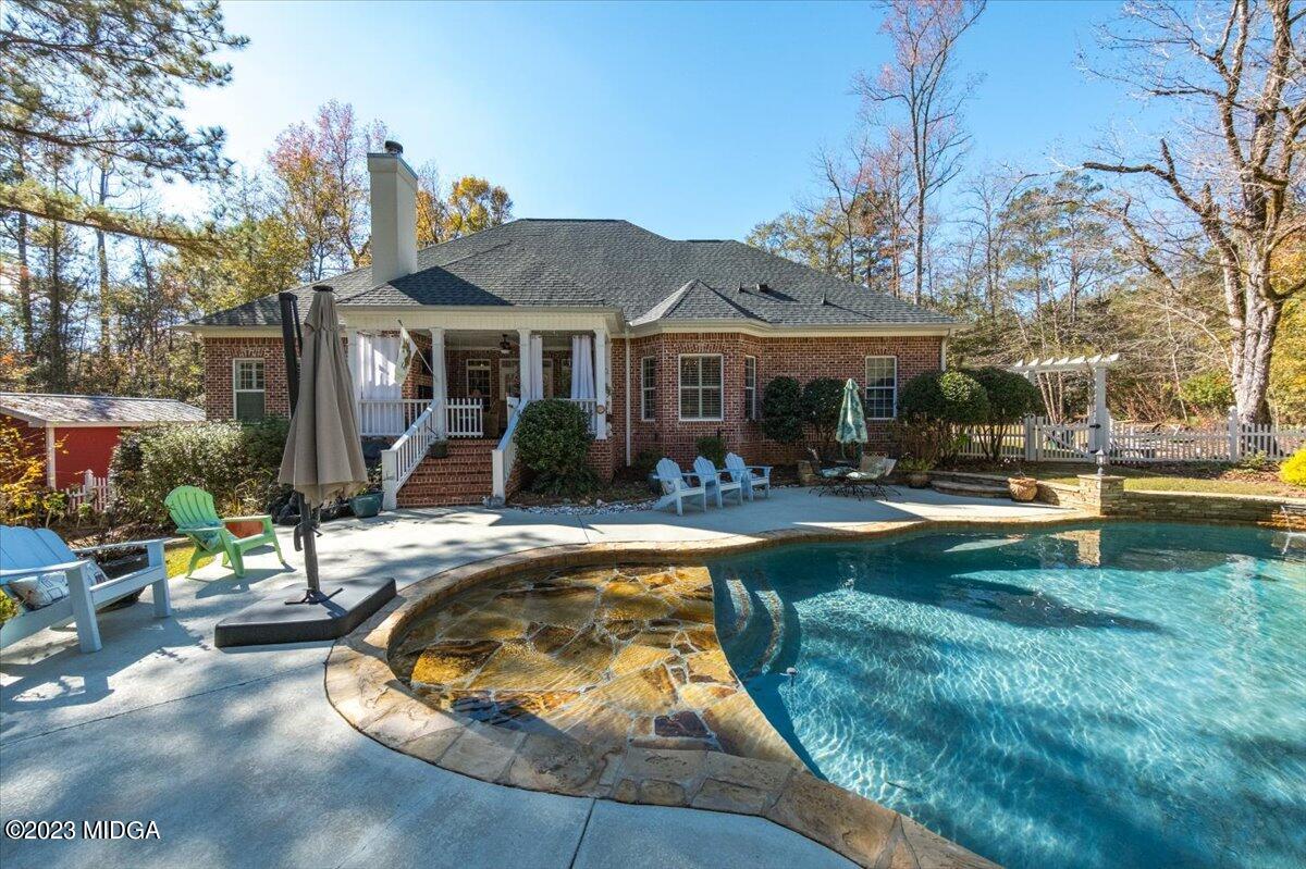 60 Walden Road Forsyth, GA 31029 - Photo 29 of 31 a view of a house with swimming pool and sitting area