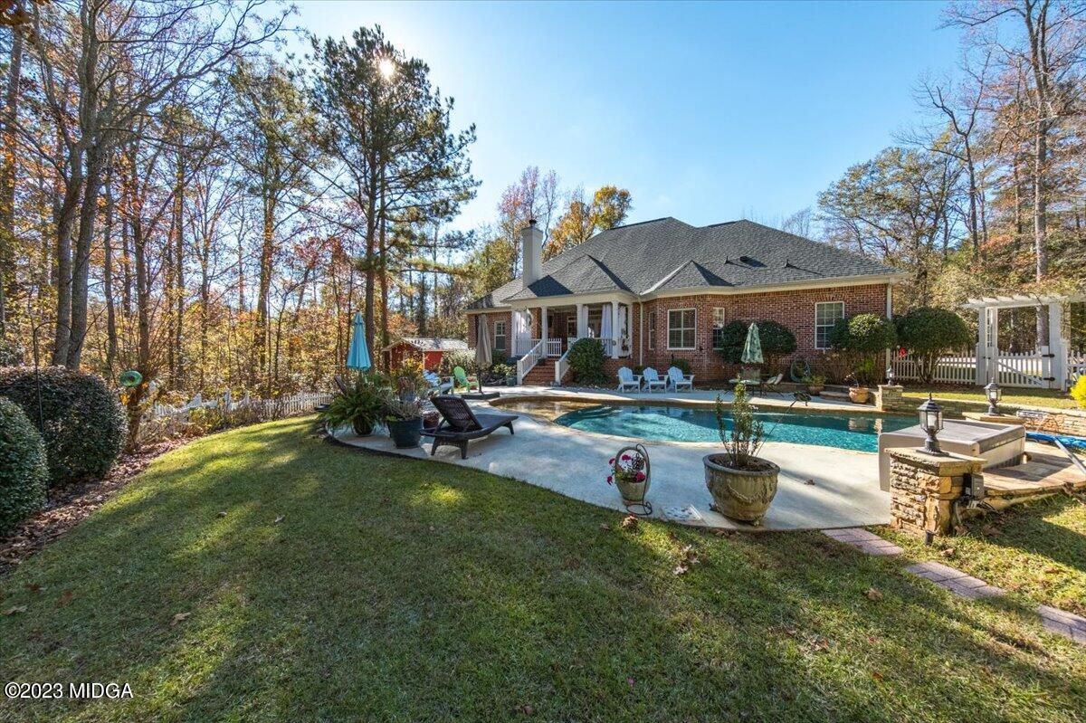 60 Walden Road Forsyth, GA 31029 - Photo 30 of 31 a view of a house with swimming pool and sitting area