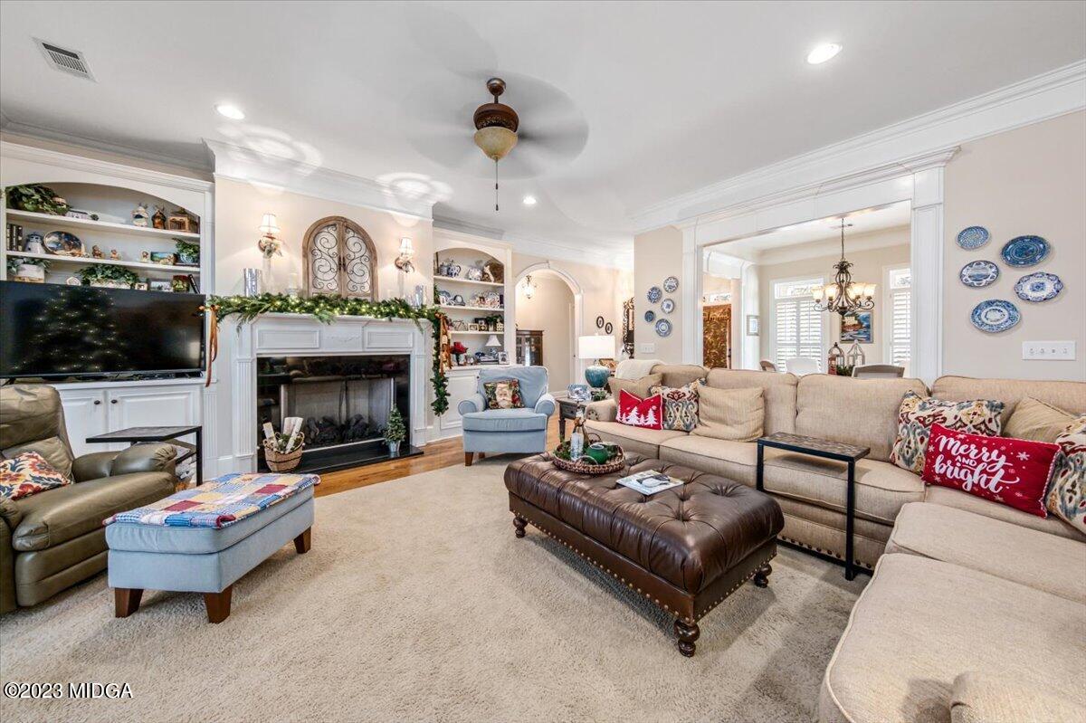 60 Walden Road Forsyth, GA 31029 - Photo 5 of 31 a living room with furniture and a fireplace