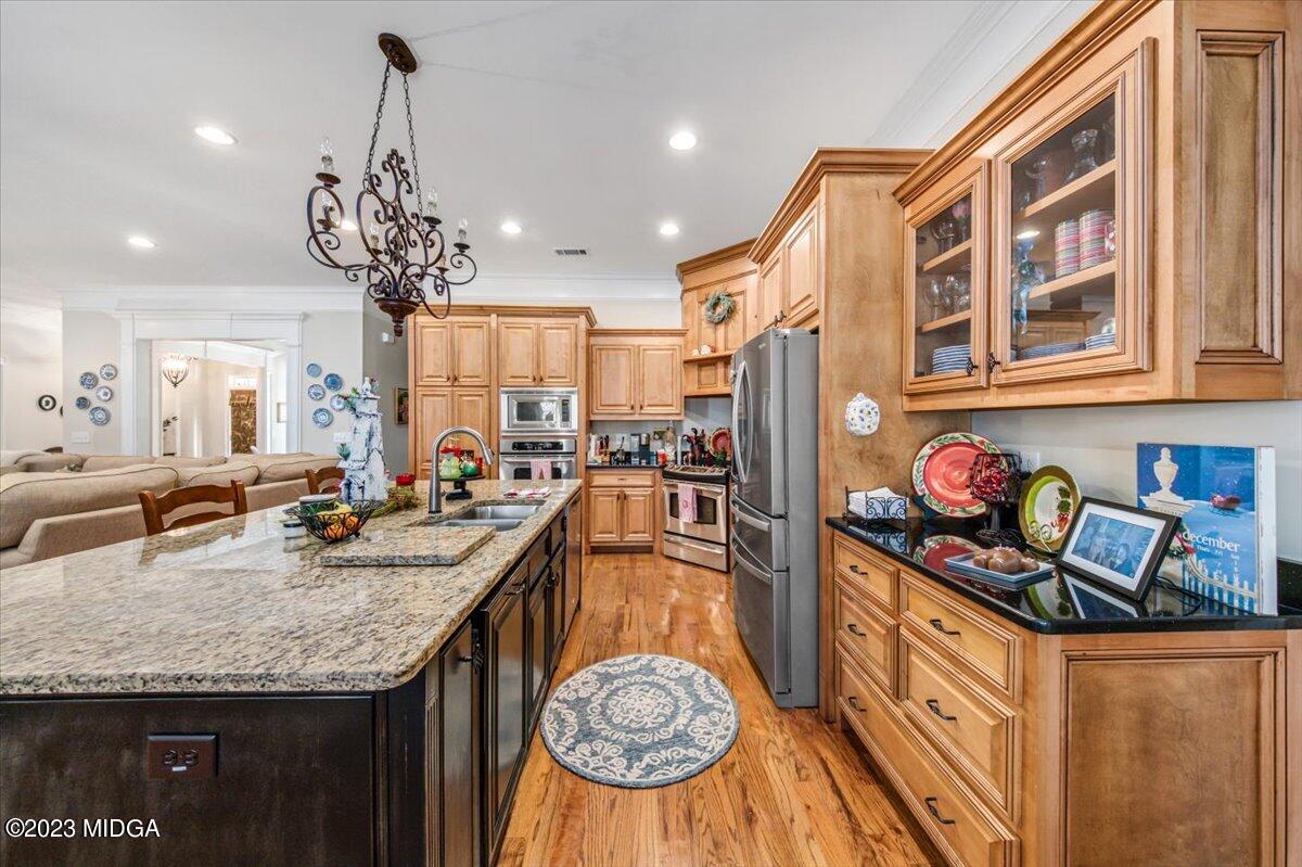 60 Walden Road Forsyth, GA 31029 - Photo 8 of 31 a very nice looking kitchen with granite countertop a stove and large cabinets