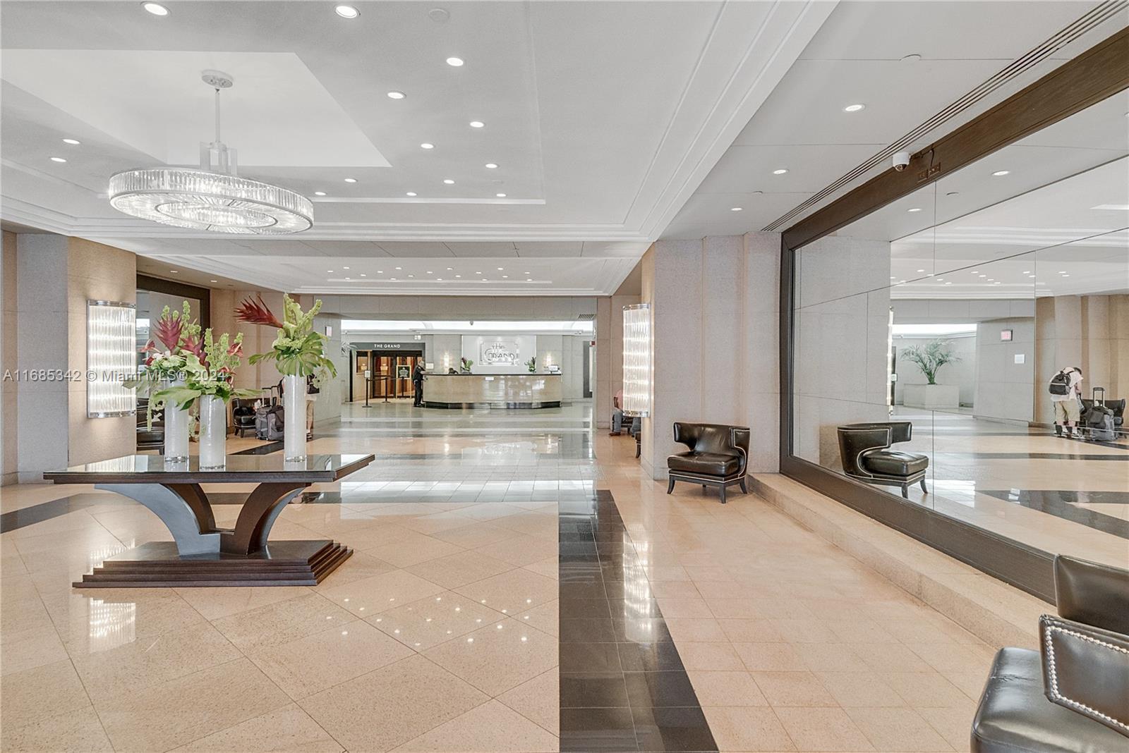 Omni Miami, FL 33132 - Photo 11 of 51 a lobby with furniture and a chandelier
