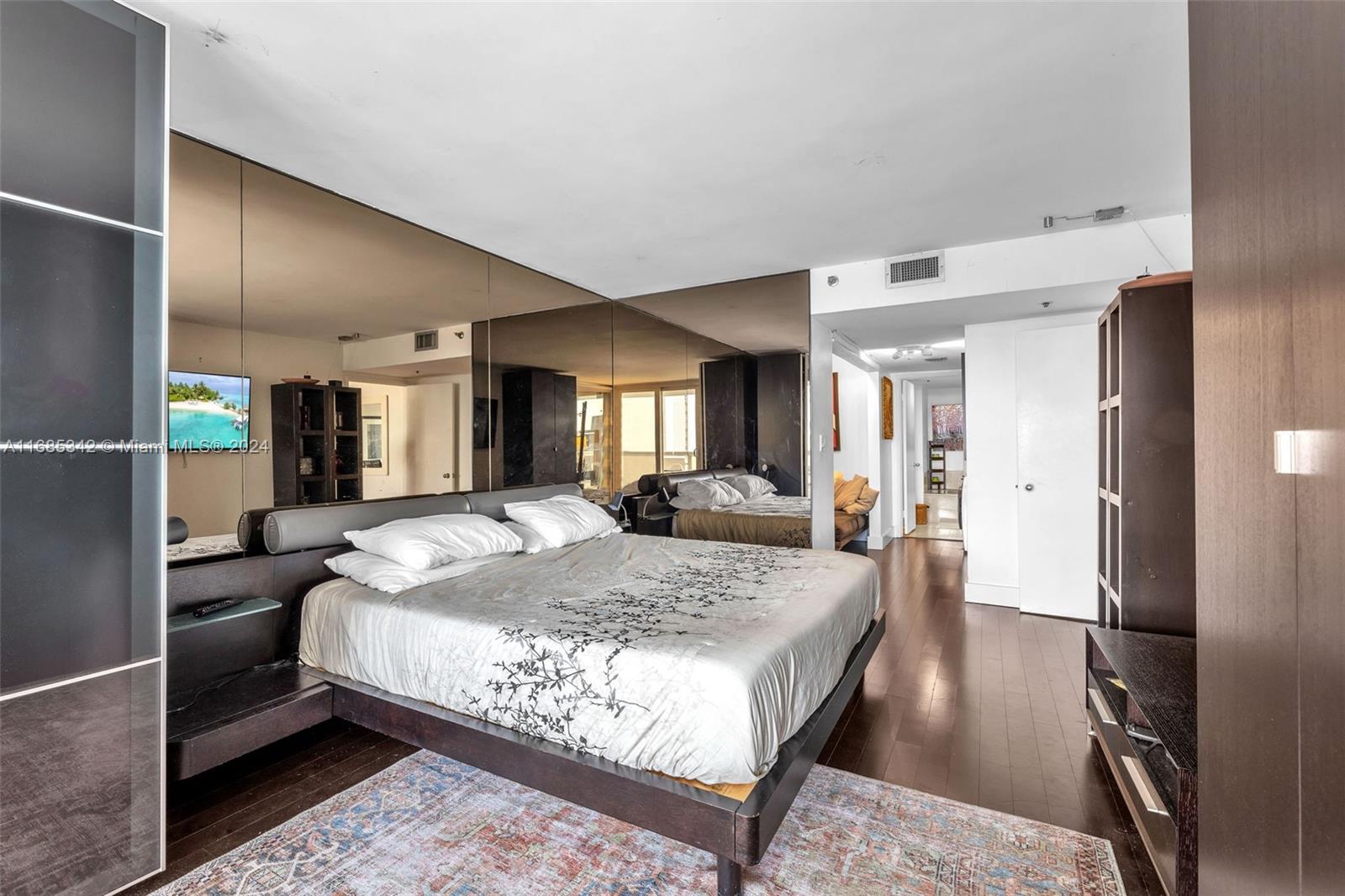 Omni Miami, FL 33132 - Photo 2 of 51 a bed room with a bed and mirror