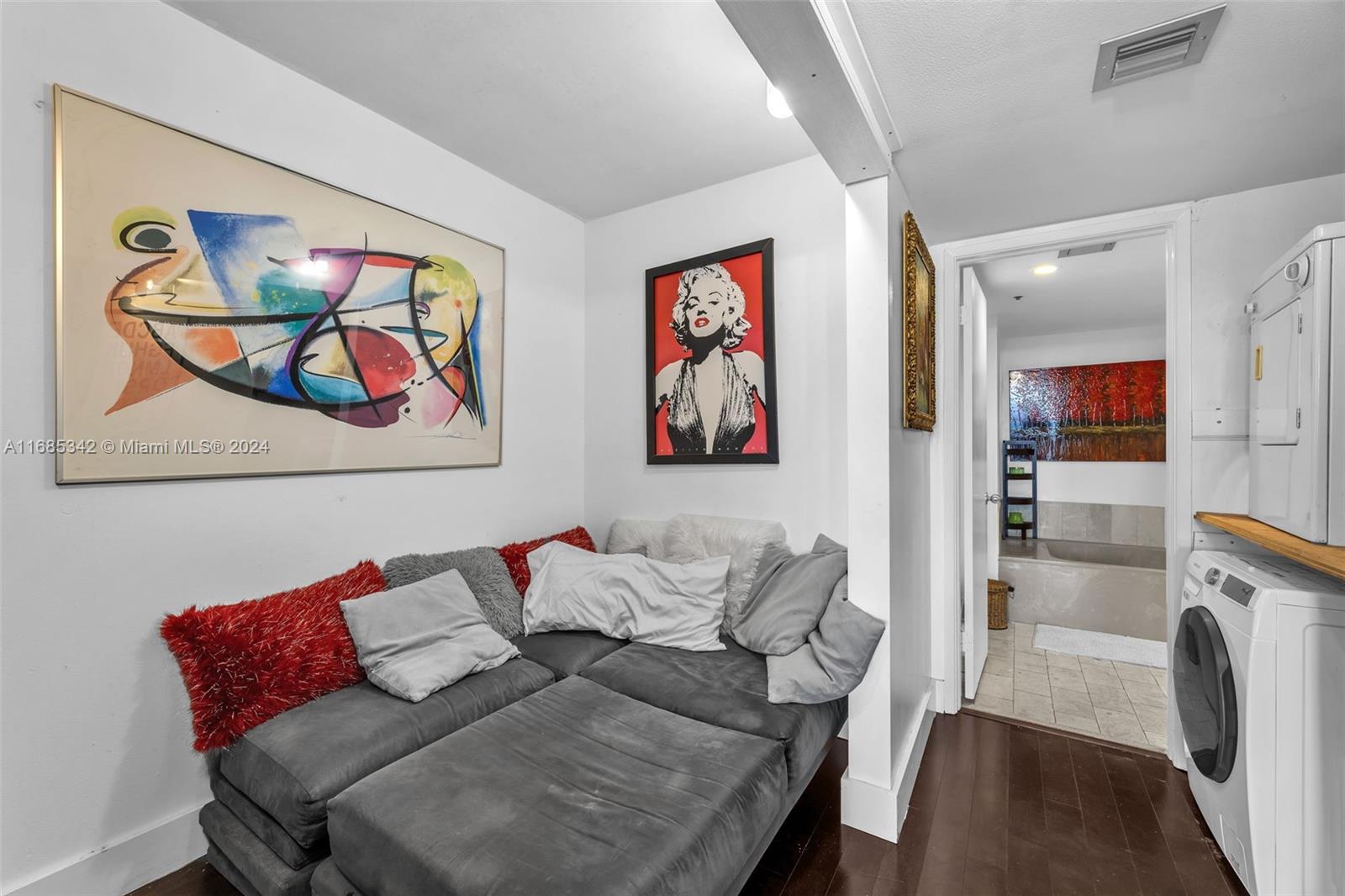 Omni Miami, FL 33132 - Photo 3 of 51 a living room with furniture and painting on the wall