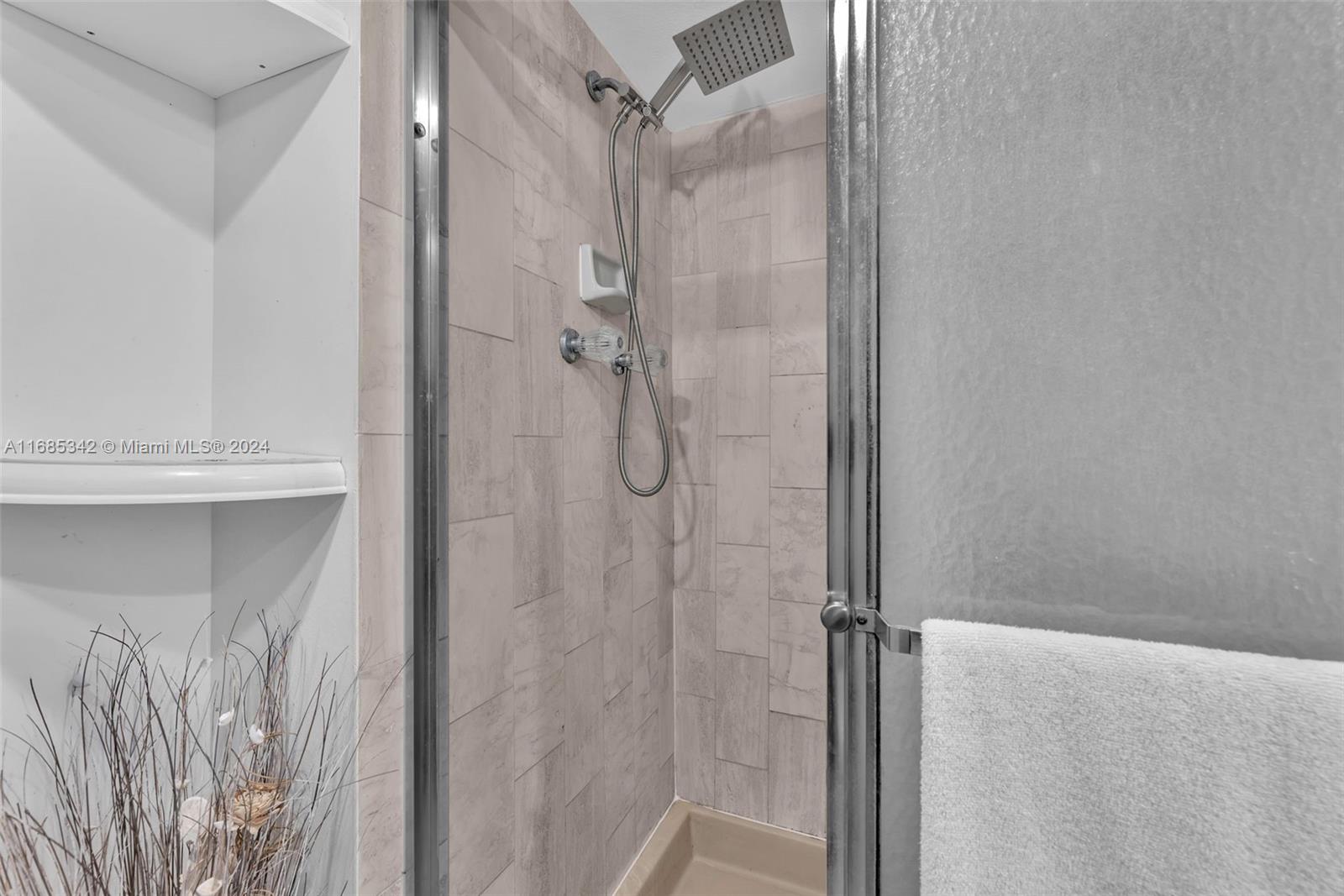 Omni Miami, FL 33132 - Photo 33 of 51 a bathroom with a glass shower door