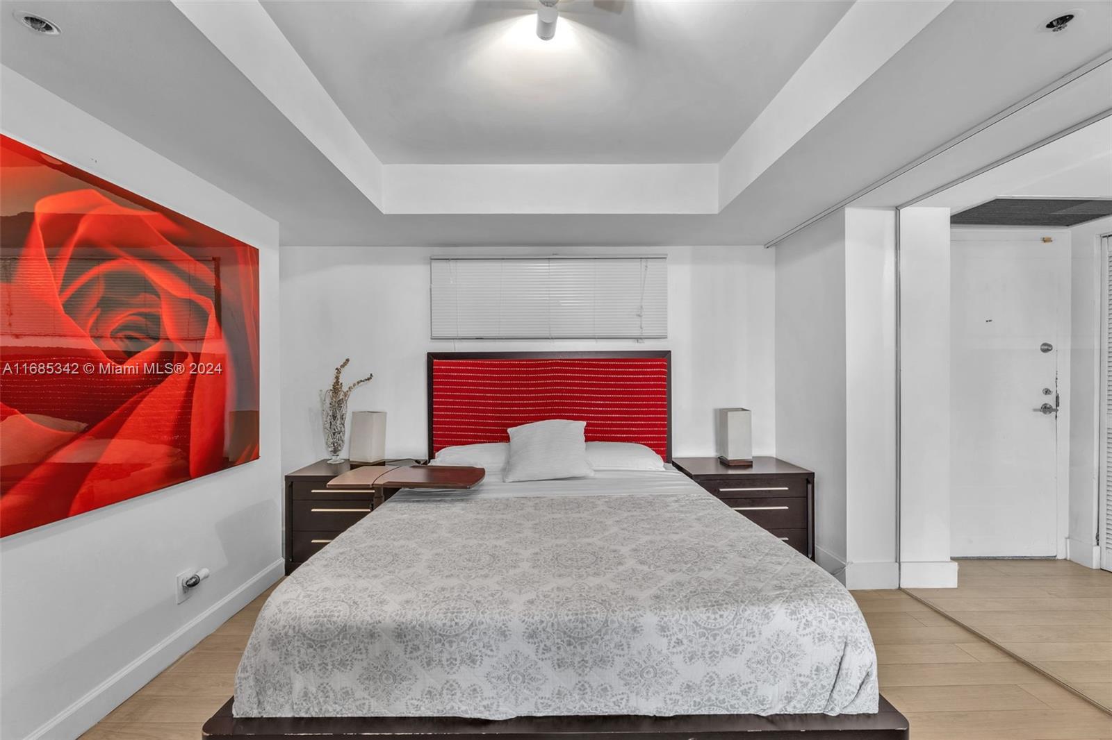 Omni Miami, FL 33132 - Photo 35 of 51 a bedroom with a bed and window