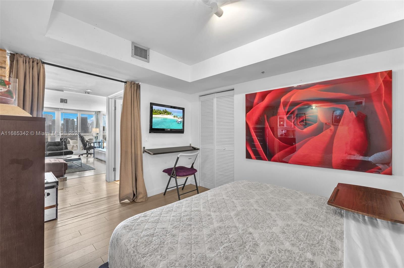 Omni Miami, FL 33132 - Photo 36 of 51 a bedroom with a bed and a couch