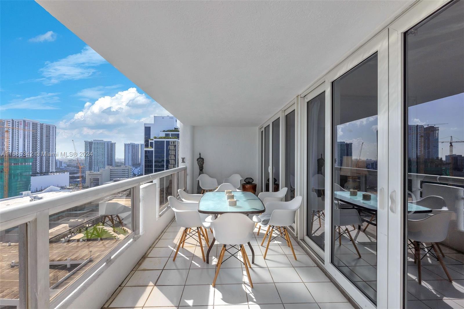Omni Miami, FL 33132 - Photo 40 of 51 a dining room with furniture and a floor to ceiling window