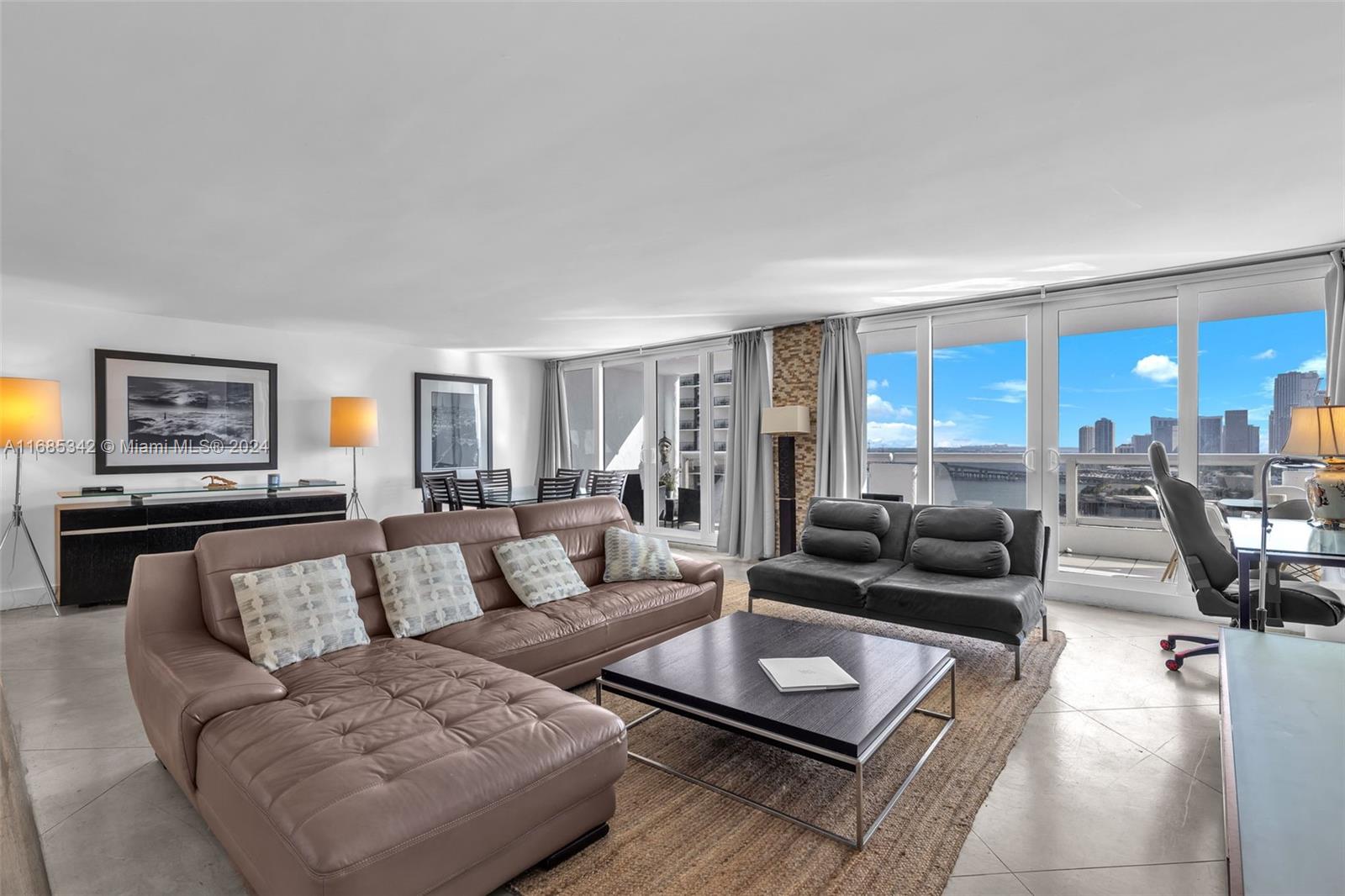 Omni Miami, FL 33132 - Photo 7 of 51 a living room with furniture and a table