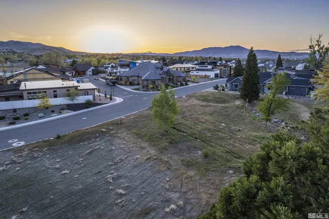 a view of a town with mountains in the background