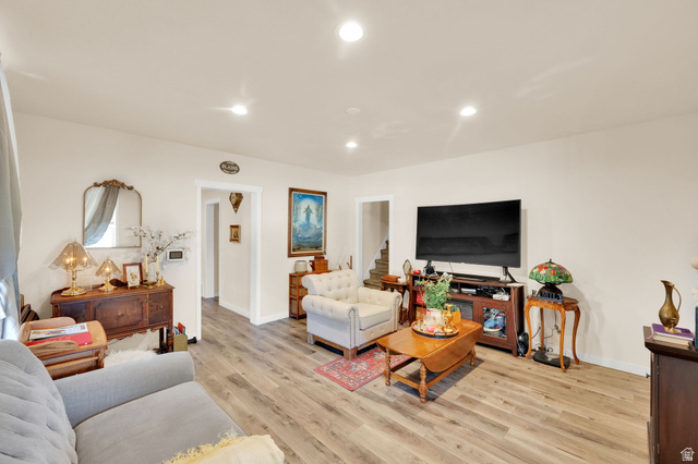 501 Canyon Road Ogden, UT 84404 - Photo 12 of 30 Open-concept living space featuring wood-finish flooring, recessed lighting, and crisp white walls