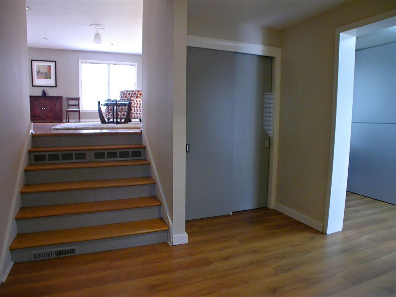 4709 Wedgewood Street Raleigh, NC 27612 - Photo 10 of 25 New front foyer with new garage wall, front door,window, flooring, lighting and trim for a unique experience leading up to the second level. Hallway