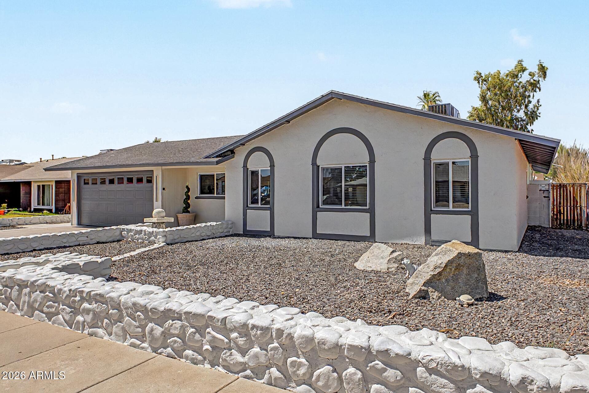 5232 West Hearn Road Glendale, AZ 85306 - Photo 31 of 32 a front view of a house with a yard