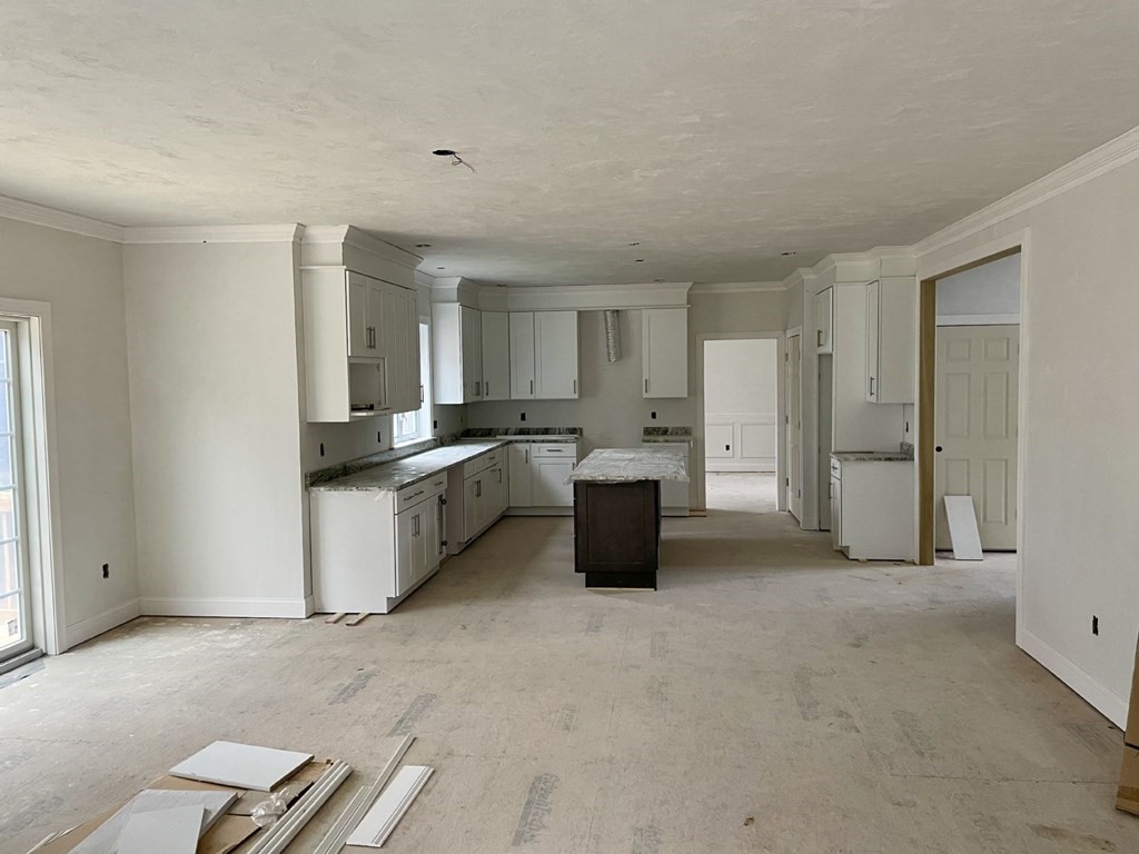 7 Applegate Road Medway, MA 02053 - Photo 3 of 10 a large kitchen with a refrigerator a sink dishwasher with a stove and cabinets